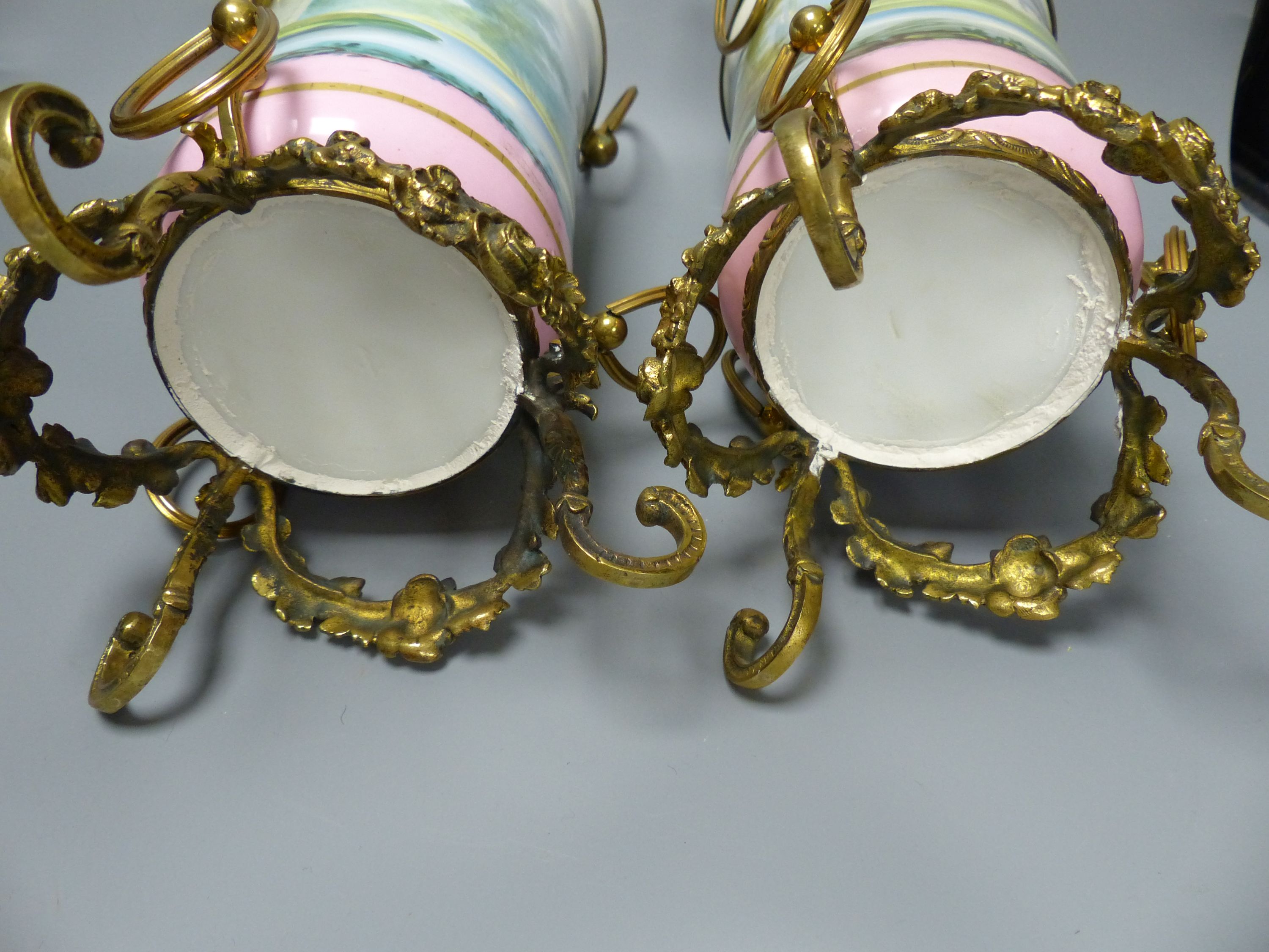 A pair of late 19th century Paris porcelain and gilt metal mounted vases, height 33cm